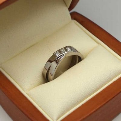 Beautiful palladium bezel set three stone engagement ring