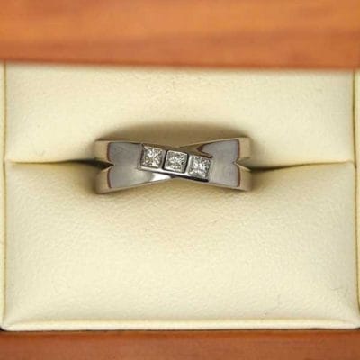 Beautiful palladium bezel set three stone engagement ring