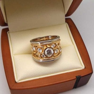 Beautiful filigree two colour metal diamond ring
