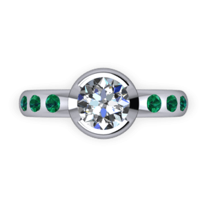 Part bezel set diamond and emerald ring