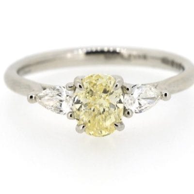 Three stone yellow diamond ring