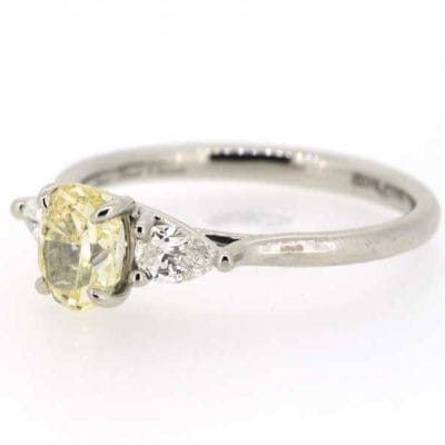 Three stone yellow diamond ring