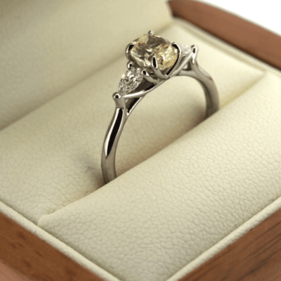 Three stone yellow diamond ring