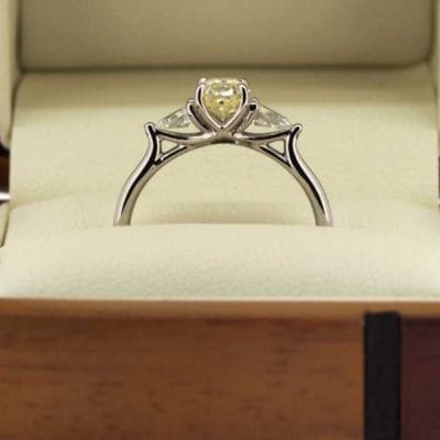 Three stone yellow diamond ring