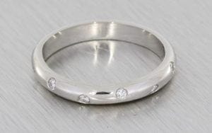 Classic platinum band with asymmetric set diamonds