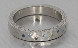 Palladium flush set hammered textured band