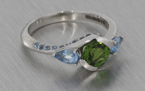 Platinum and Tourmaline trilogy with added shoulder stones