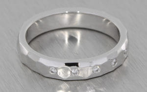 18ct white gold band set with invisible set round brilliant diamonds