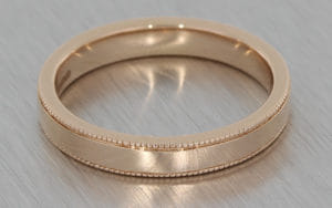 Rose gold wedding band with milgrain detailing